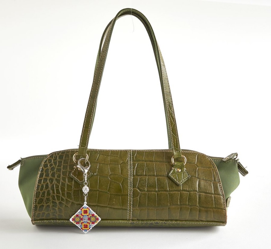 Alligator purse with argyle lace charm attached