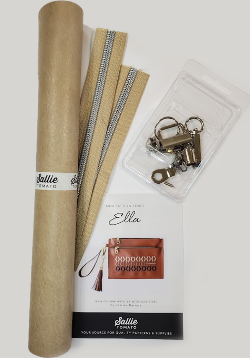 Ella Kit Contents: paper pattern, beige faux leather, zipper and pulls, key fob, tassel cap