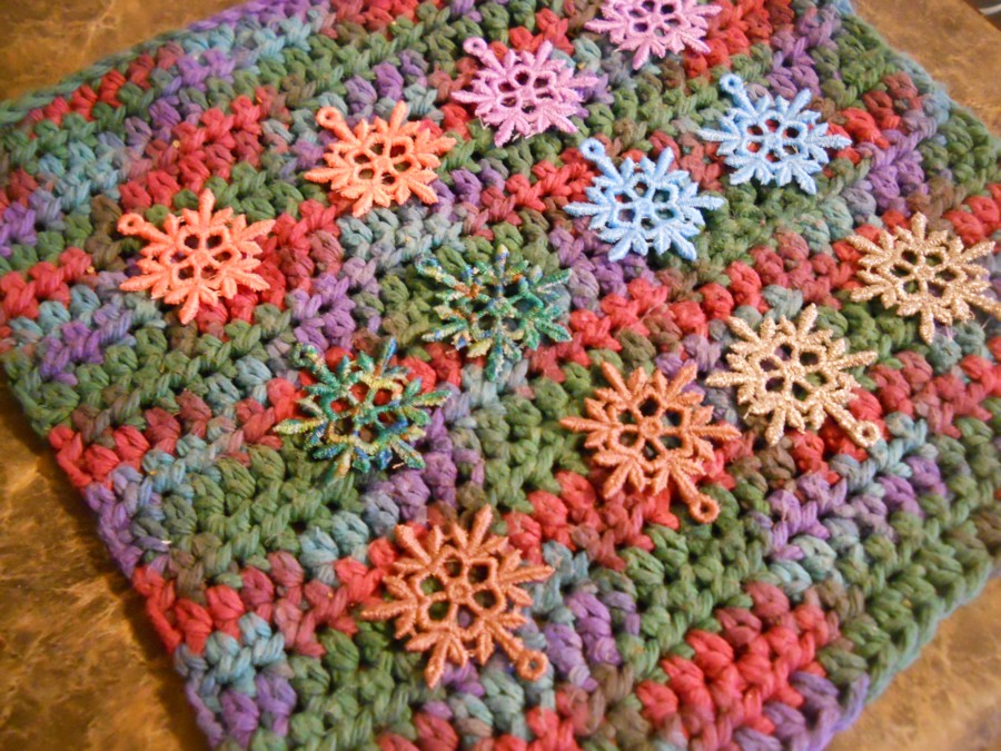 snowflakes on hand crocheted washcloth, to dry