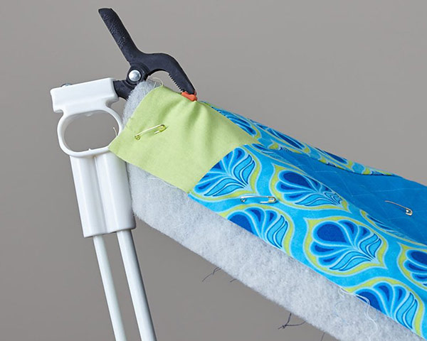 Weightless Quilter Clamp with quilt