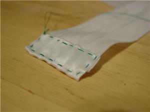 Strip of fabric with hem stitch.