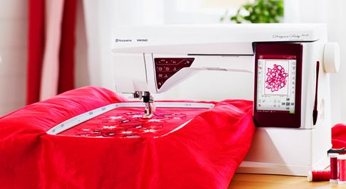 Husqvarna Viking® Designer Ruby deLuxe sewing machine.
