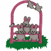 Bunnies climbing through fence